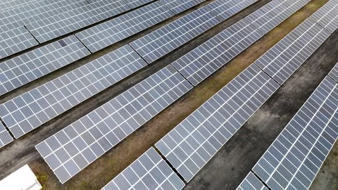 Aerial View of Large-Scale Solar Panel Farm Video stock 327984187