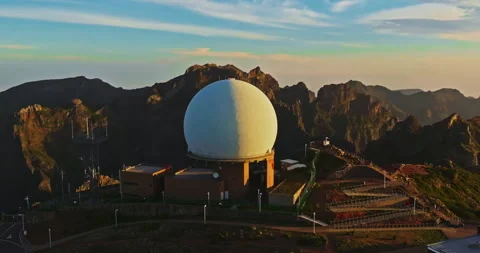 Aerial view of a large scientific observatory in the mountains at sunset Stock Footage 345445542