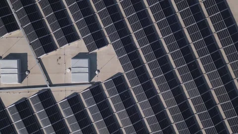Aerial view of a large solar panel installation on a commercial rooftop in a Stock Footage 285740200