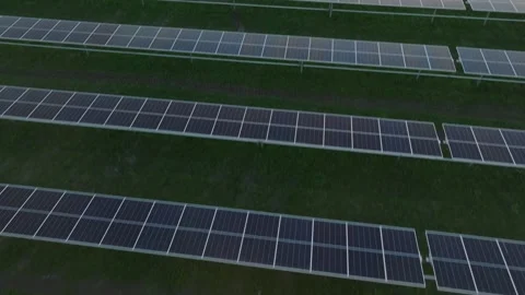 Aerial view of large solar panel array, clean energy production in green rural Stock Footage 304035447