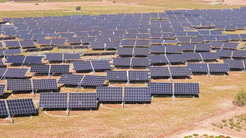 Aerial view of large solar panel farm in rural landscape with panels Stock Footage 318753007