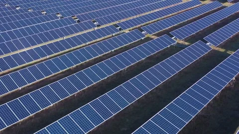 Aerial View of Large Solar Panel Farm for Renewable Energy Production Stock Footage 329710118