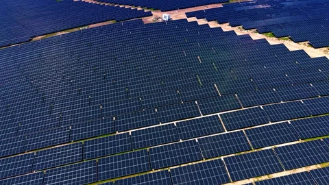 Aerial view of large solar panel array at industrial power plant. Overhead drone Stock-Footage 336386473