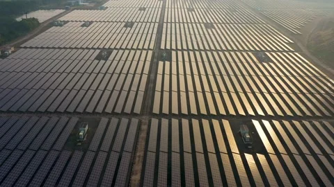 Aerial view of large solar panels at solar farm at sunrise in sunny spring. S Video stock 169088957