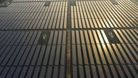 Aerial view of large solar panels at solar farm at sunrise in sunny spring. S Video stock 169089061