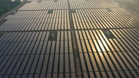 Aerial view of large solar panels at solar farm at sunrise in sunny spring. S Stock Footage 170006552