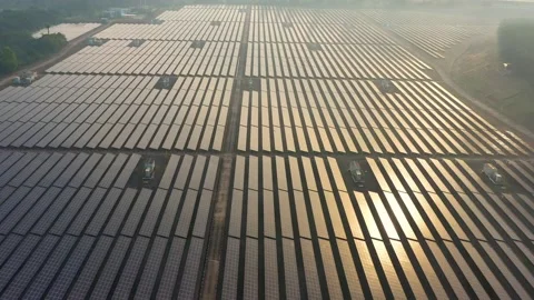 Aerial view of large solar panels at solar farm at sunrise in sunny spring. S Stock Footage 170770568