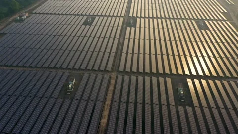 Aerial view of large solar panels at solar farm at sunrise in sunny spring. S Stock Footage 170770657