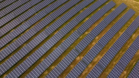 Aerial view of large solar power farm with photovoltaic panels generating clean Stock Footage 316637843