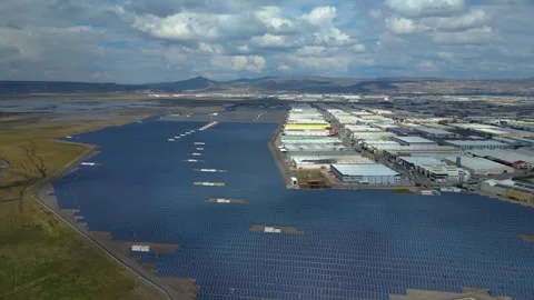 Aerial View of Large Solar Power Plant Next to Industrial Area 스톡 동영상 331565786