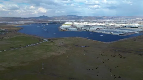 Aerial View of Large Solar Power Plant Next to Industrial Area Video stock 331567075
