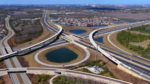 An aerial view of a large stack interchange on Florida's Turnpike on a sunny Видео 331569480