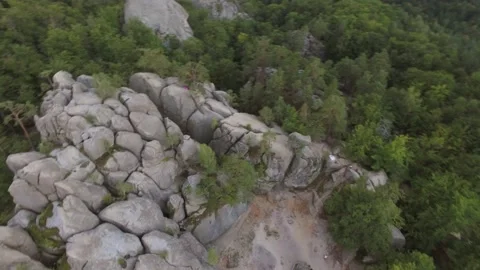 Aerial view large stone rocks wild woods and mountain scenery Tourist attraction Stock Footage 213571051