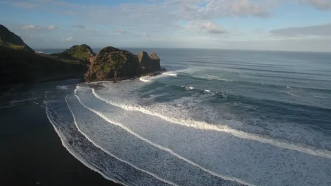 Aerial view large surfing waves at Piha Beach, New Zealand Stock Footage 90316293