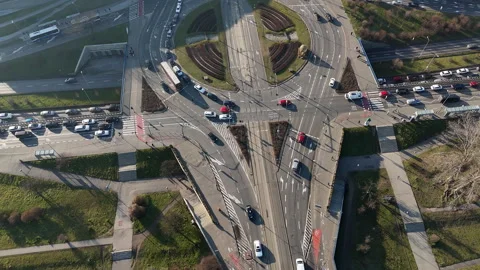 Aerial view of a large traffic roundabout with multiple lanes and tram tracks in Stock Footage 301334623