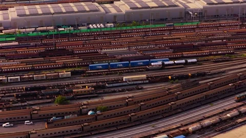 Aerial view of large train depot in Bangkok. Numerous freight and passenger trai Stock Footage 335318856