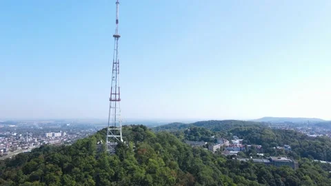 Aerial view of the large TV tower on the mountain in the urban area 스톡 동영상 161121990