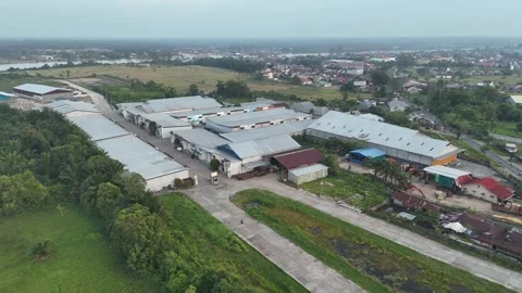 Aerial View of Large Warehouse Complex and Surrounding Rivers 스톡 동영상 347177909