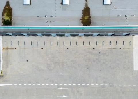 Aerial view of a large warehouse loading dock with empty spaces.  Ready for.. Stock Photos