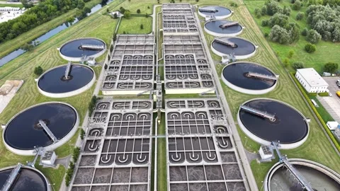 Aerial view of a large water purification complex for a city, circular tanks Stock Footage 340666043