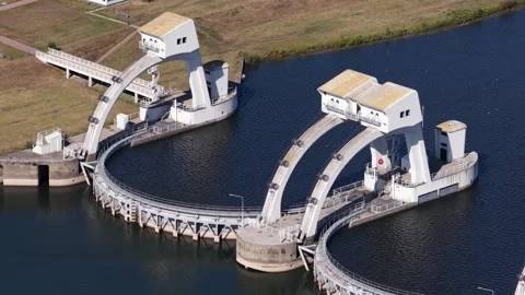 Aerial view of a large weir regulating water flow Видео 344059485