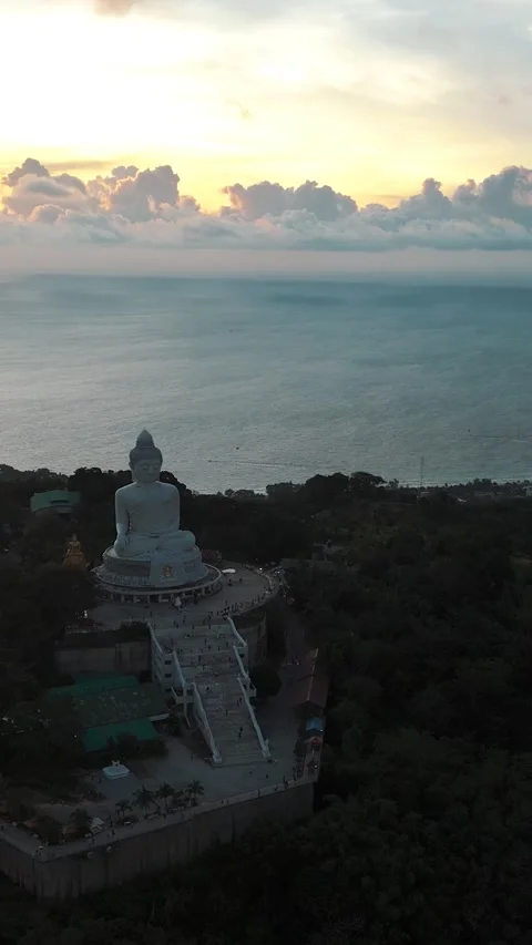 Aerial View of Large White Marble Buddha Statue on Hillside at Sunset Stockbeeldmateriaal 334101650