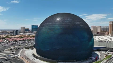Aerial view of Las Vegas Sphere venue showing giant dark storm clouds visual Stock Footage 345104355
