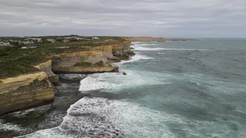 Aerial view of layered limestone cliffs and ocean Stock Footage 336002010