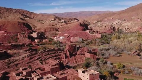 Aerial View of Layered Mudbrick Settlements and Red Valley Basin in Tinghir Stock Footage 345936747