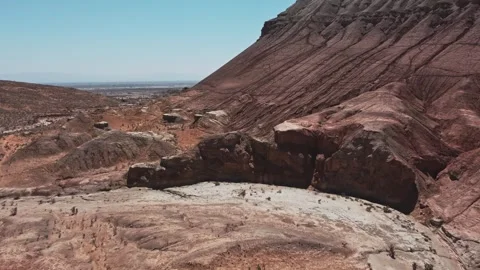 Aerial view of layered red sandstone and eroded canyon in Altyn Emel Stock Footage 345410161