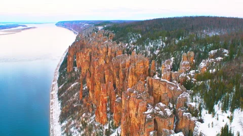 Aerial view of Lena Pillars stone forest along the river in winter Stock Footage 337022418