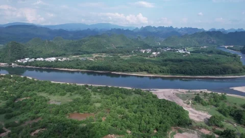 Aerial View of Li River Winding Through Lush Green Karst Mountains in Guilin Video stock 342103316