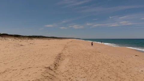 Aerial View Lifting Up from Beach with Waves Breaking On Right Side Stock Footage 99019801