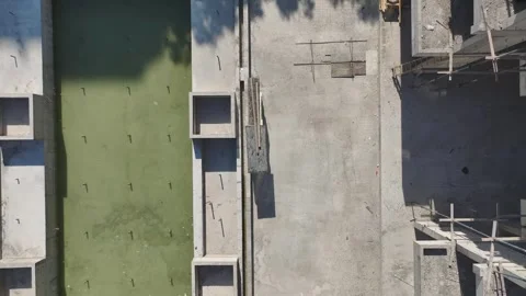 Aerial View: Lifting materials and shaping metal structures define this active Stock Footage 296174716