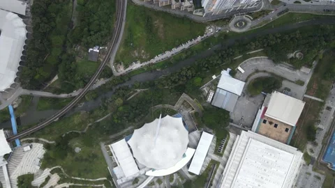 Aerial view Light Rail Transit and Apartment during MCO Stock Footage 148425798
