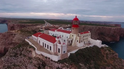 Aerial View lighthouse and cliffs at Cape St. Vincent at sunset. Europe's most Stock Footage 75299525