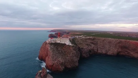 Aerial View lighthouse and cliffs at Cape St. Vincent at sunset. Europe's most Stock Footage 75299863