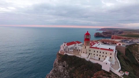 Aerial View lighthouse and cliffs at Cape St. Vincent at sunset. Europe's most Stock Footage 75299941