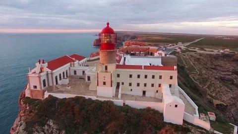 Aerial View lighthouse and cliffs at Cape St. Vincent at sunset. Europe's most Stock Footage 75300010