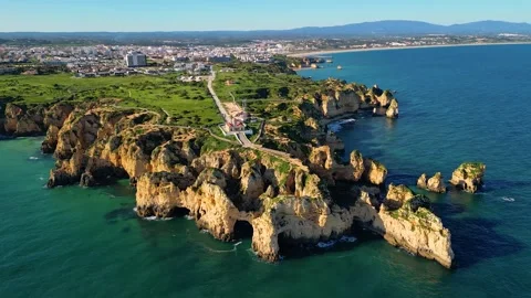Aerial View on Lighthouse and Cliffs in Lagos Algarve Portugal Stock-Footage 332344394