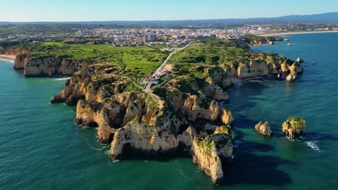 Aerial View on Lighthouse and Cliffs in Lagos Algarve Portugal Stock Footage 332344608