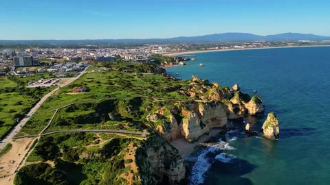 Aerial View on Lighthouse and Cliffs in Lagos Algarve Portugal Stock Footage 332344675