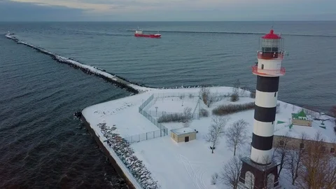 Aerial view of the lighthouse and a ship entering the harbour Stock Footage 101828229