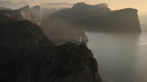 Aerial view of lighthouse Cap de Formentor on massive cliff coast, Mallorca Stock Footage 285592835