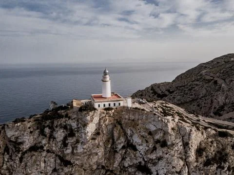 Aerial view on Lighthouse of Cap de Formentor. Wide view of wild rocky cliffs. Stock Photos