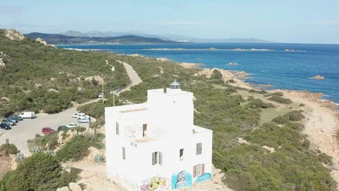 AERIAL VIEW OF THE LIGHTHOUSE IN CAPO COMINO ,SINISCOLA, SARDINIA Stock-Footage 127299973