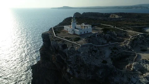 Aerial view of lighthouse on the edge of a cliff Stock Footage 116619337