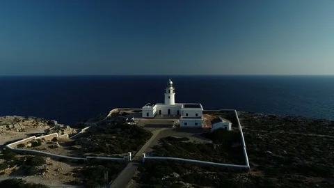 Aerial view of lighthouse on the edge of a cliff Stock Footage 116619763
