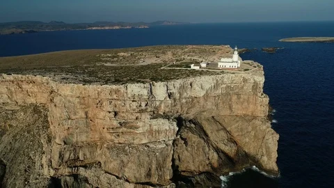 Aerial view of lighthouse on the edge of a cliff Stock Footage 116619861