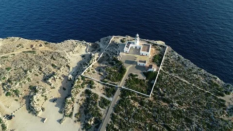 Aerial view of lighthouse on the edge of a cliff Stock Footage 116620098